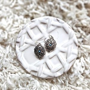 Silver Laced Pattern Earrings with a Blue Center